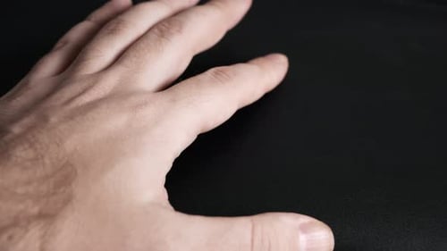 Close Up of Hand on Black Background