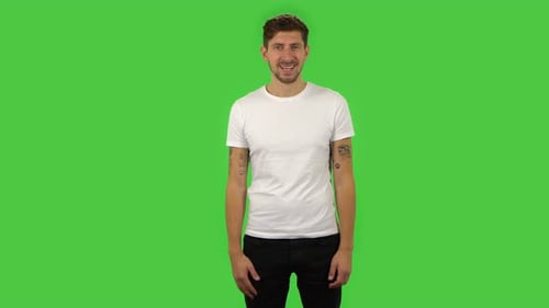 Confident Guy Is Smiling Broadly and Winking. Green Screen