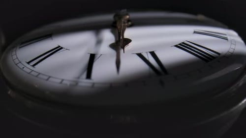 Pocket Watch Hands Moving in Dark Environment
