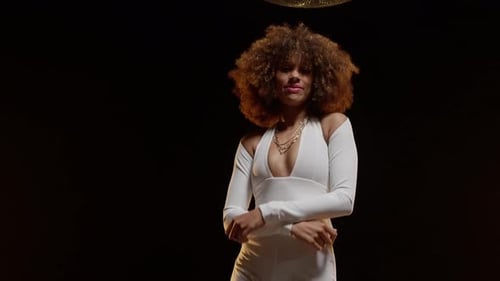 Smiling African American Woman with Afro Style Hairs Dancing on the Stage