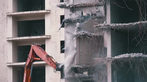 Building Demolition with Excavator in Urban Environment