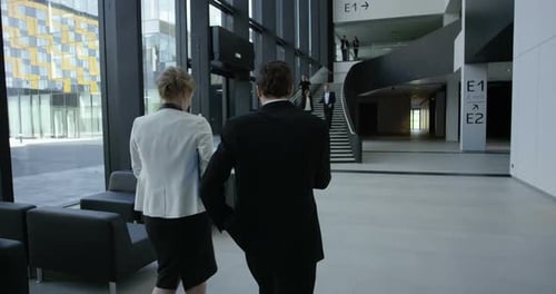 Business people at hall of office building