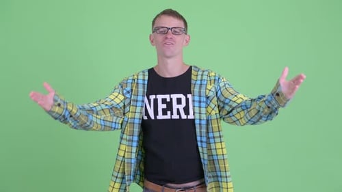 Man Waving and Sending Kisses in Front of Green Screen
