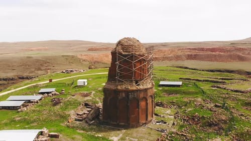 Historical Stone Building with Domed Roof in Rural Setting