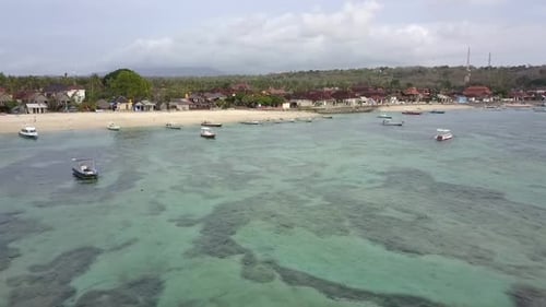 Dramatic fast aerial view flight fly forwards drone footage over the reef over crystal clear turquoi