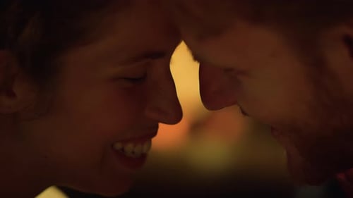 Loving Couple Touching Foreheads Intimately in Warm Light