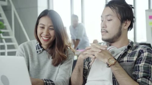 Teamwork on Laptop in Bright Modern Office