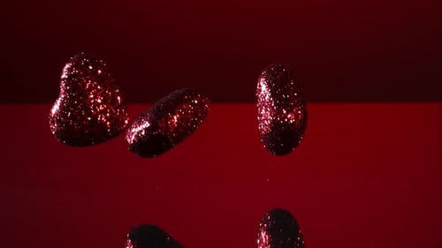 Decorations falling, bouncing in ultra slow mo 1500fps - reflective surface - VALENTINES PHANTOM