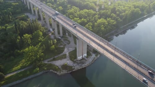 Aerial View of a Bridge Over a Large River with Heavy Traffic