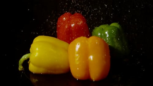 Water drizzling on peppers, Ultra Slow Motion