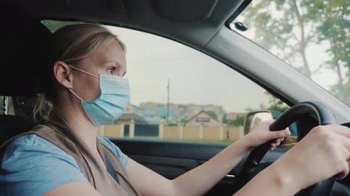 Adult Woman Driving Car Wearing Face Mask