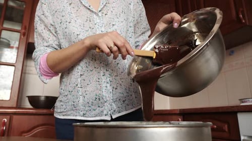 Pouring the cake batter into the baking pan