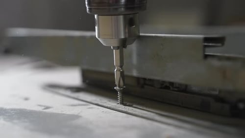 Close-up of Screw Being Drilled into Metal