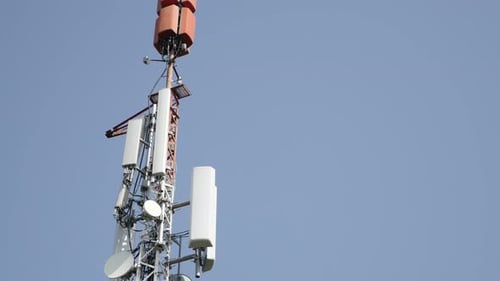 Telecommunications Tower Against Light Blue Sky