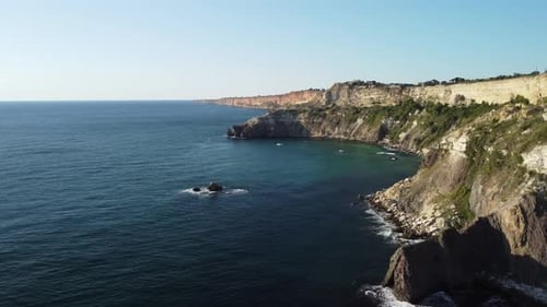 Aerial Panoramic View of Seascape with Crystal Clear Azure Sea and Rocky Shores