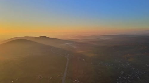 Sunset View From Mountain Top Beautiful Dramatic Sunlight Shining Through Orange Clouds Landscape