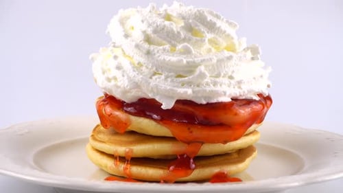Pancakes with Strawberry Sauce and Whipped Cream