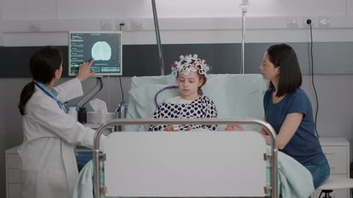 Pediatrician Woman Doctor Monitoring Sickness Evolution While Analyzing Brain Tomography Expertise
