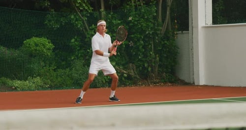 Tennis players playing a point