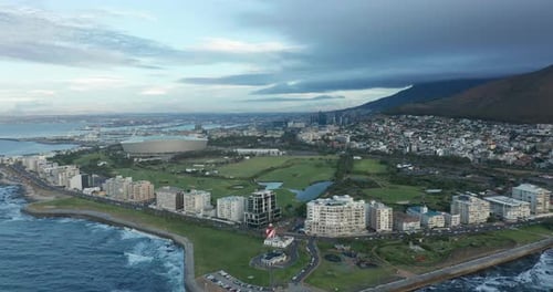 Wide Aerial Shot Tracking Forward Into the City of Cape Town During a Spectacular Sunset with Table