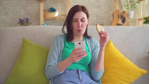 Young Woman with Toothache While Eating