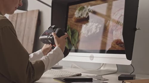 Photographer Viewing Food Image on Computer