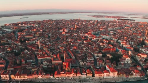 Slider drone shot over the west side of Venice island at sunset