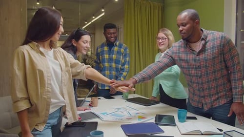 Enthusiastic Team Celebration in Modern Workplace