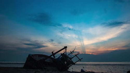 time-lapse of local fishing boat on tropical beach sunset, Thailand : 4k