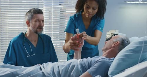 Doctor Visiting Patient in Hospital