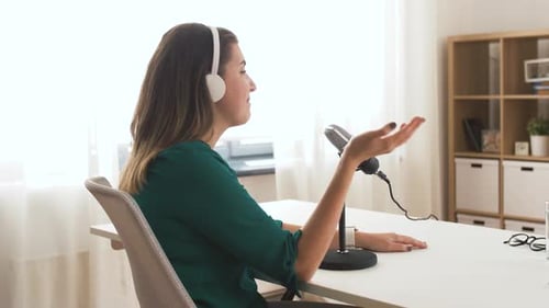 Woman with Microphone Recording Podcast at Studio