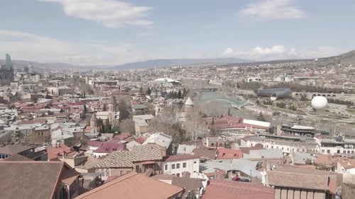 Aerial view of Tbilisi city central park and Bridge of Peace. Beautiful cityscape of old Tbilisi