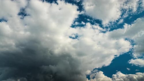 Dramatic Clouds Moving Across a Blue Sky