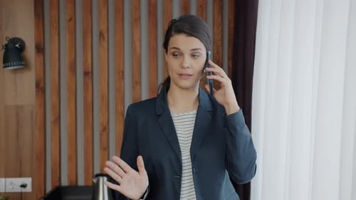 Young Businesslady Speaking on Mobile Phone From Hotel Calling Discussing Business