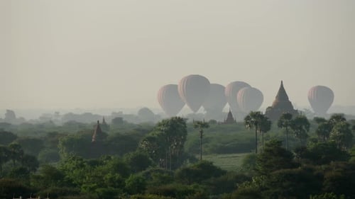 Balloons landing together close to the Pagodas