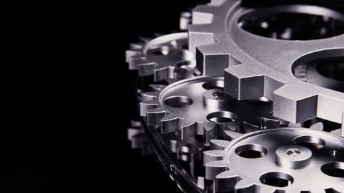 Silver Gears Interlocking Close Up on Black