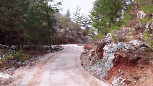 Driving along mountain road.