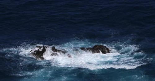 Wave crash into rock coastline, Atlantic Ocean, Porto Moniz, Madeira Island Portugal, Slow Motion 4K