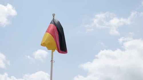 German Flag Waving Against Blue Sky