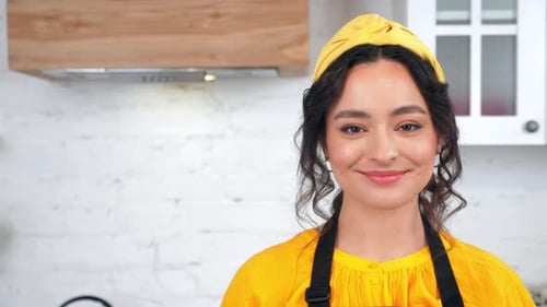 Close Up Smiling Housewife Turns Head Looking Camera in Home Modern Kitchen