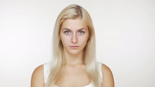Blonde Woman Looking at Camera in Studio