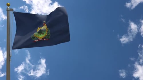 Vermont State Flag Waving Against Blue Sky