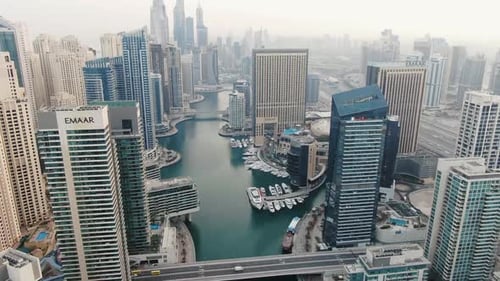 Aerial View on the City of Dubai and Dubai Creek with Luxury Yachts