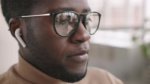 Man with Glasses Talking at the Office