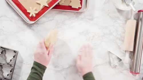 Woman Rolling Cookie Dough for Holiday Baking