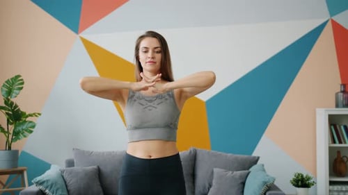 Woman Stretching Arms and Hands at Home