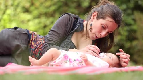 Mother with her baby daughter at park spending some quality time together