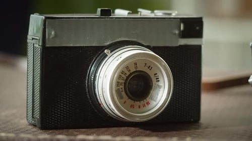 Vintage Film Camera Displayed in Close-up Footage