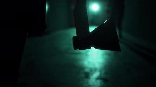 Axe in dark corridor at night