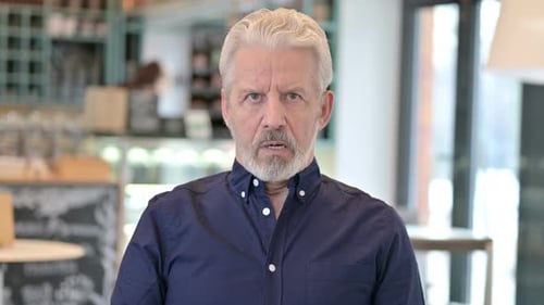 Senior Man Staring Directly At Camera